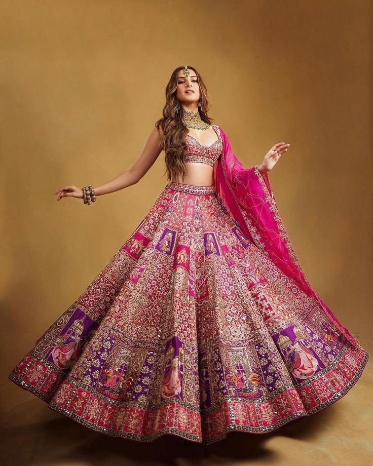 Model wearing a pink embroidered lehenga.